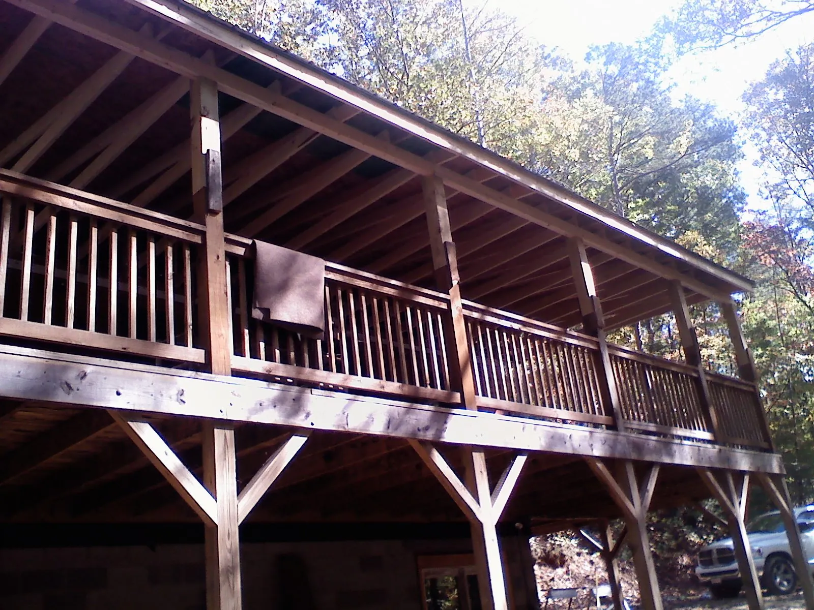 Timber framing under a new elevated porch and deck — Roof Leak Repair in Meredith by Roofing Brothers